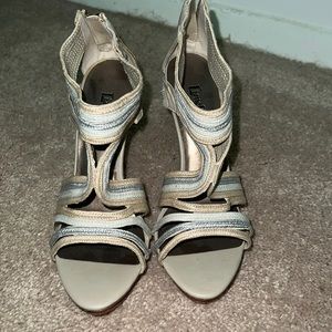 Beige, silver, and gold heels